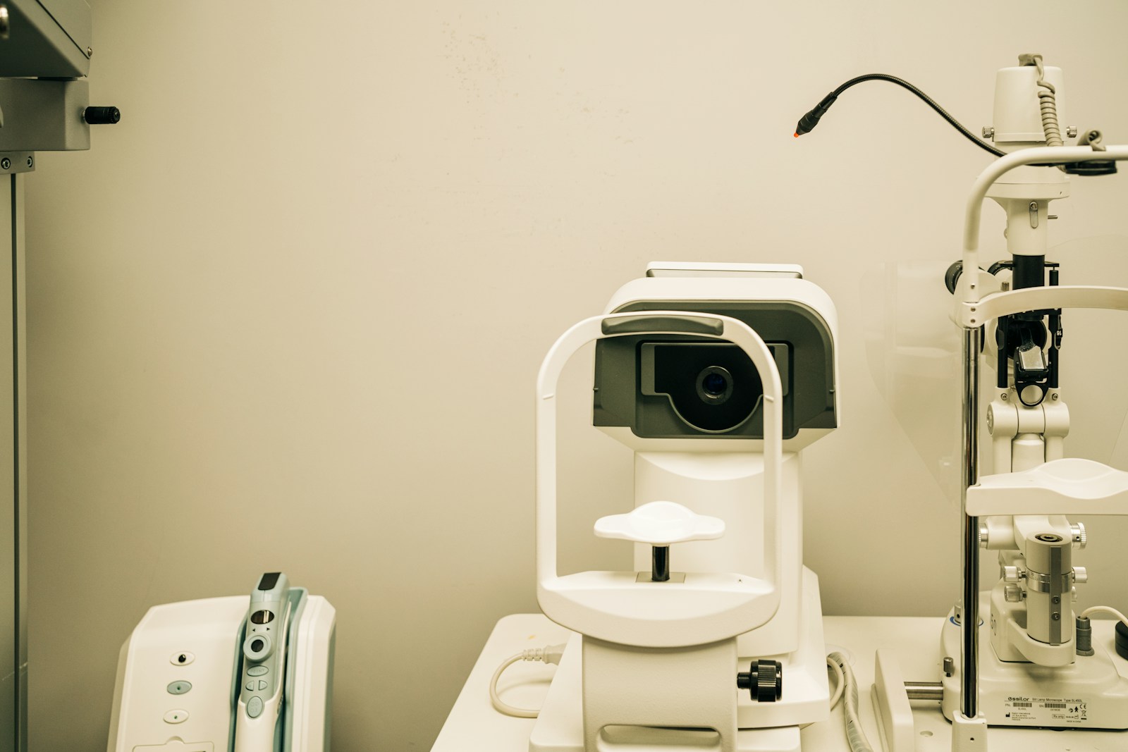 a microscope sitting on top of a table next to a camera